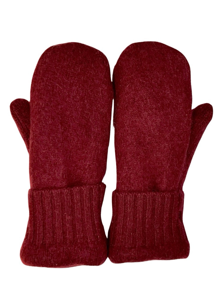 Traditional mittens are made from felted, fleece lined wool & are decorated with vintage or reclaimed buttons. Mittens fit most average women’s hands. Measurements: 11”L, 4”, 1” thick