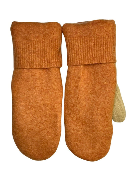 Traditional mittens are made from felted, fleece lined wool & are decorated with vintage or reclaimed buttons. Mittens fit most average women’s hands. Measurements: 11”L, 4”, 1” thick